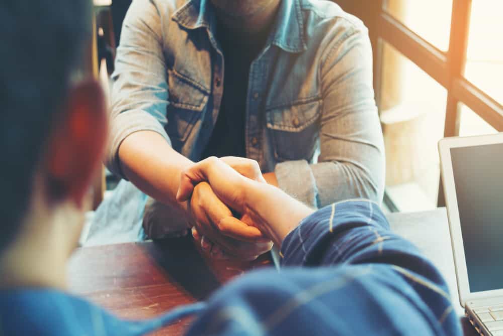 Two people shaking hands